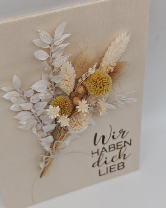 Trockenblumenschild "Wir haben dich lieb" gelb