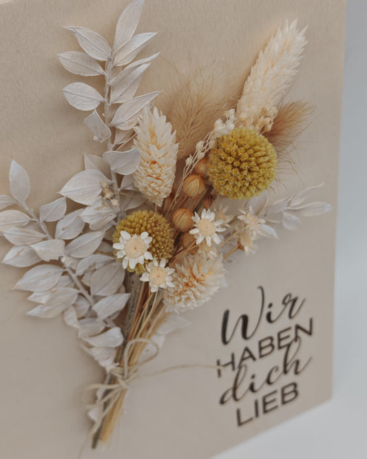 Trockenblumenschild "Wir haben dich lieb" gelb